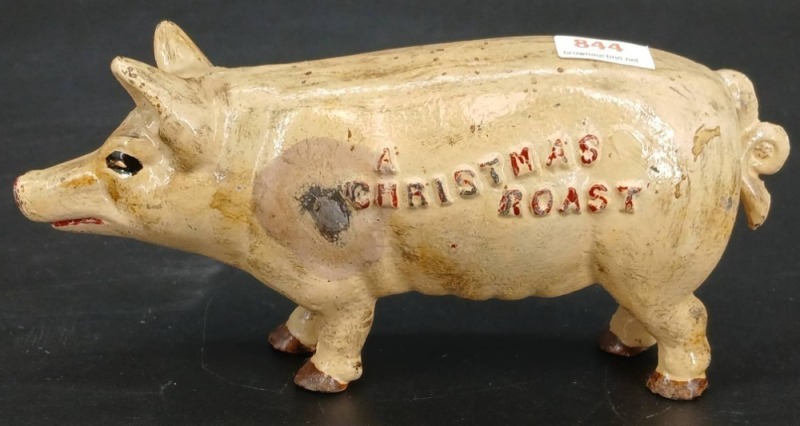 Cast Iron Pig Bank with embossed 'Christmas Roast' Text
