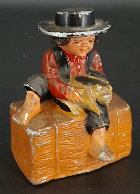 Cast Iron Boy Holding Pig Still Bank